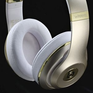 beats by dr dre gold and white muffs shot for electronic product photography example